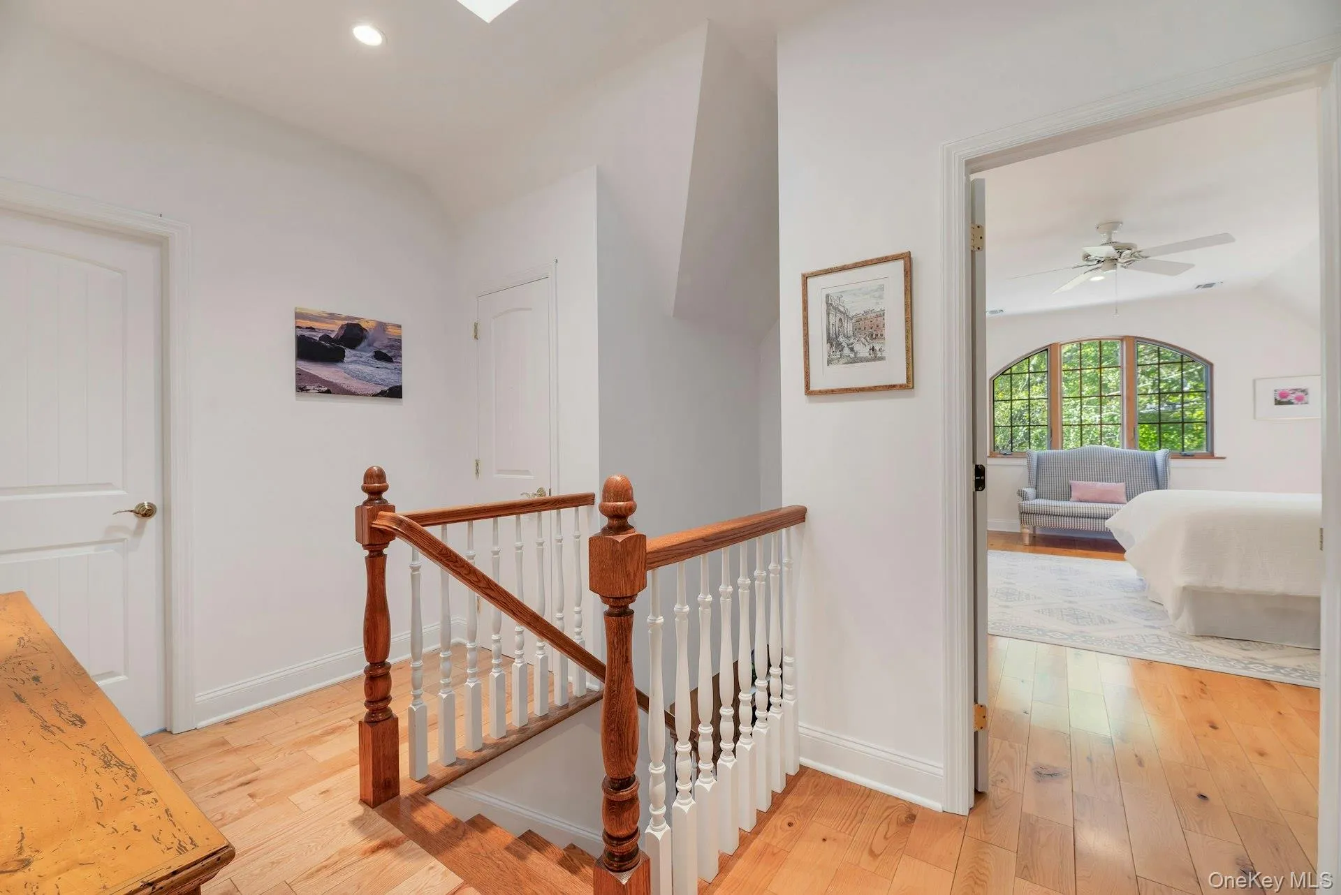 Corridor featuring an upstairs landing, light wood-type flooring, and recessed lighting Corridor featuring an upstairs landing, light wood-type flooring, and recessed lighting
