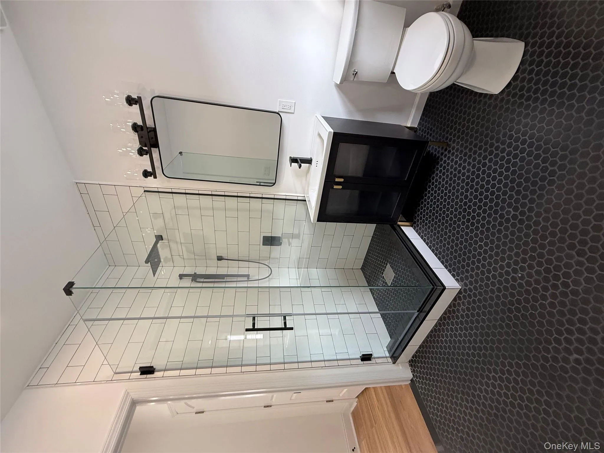 Full bathroom featuring vanity and large custom shower stall Full bathroom featuring vanity and large custom shower stall