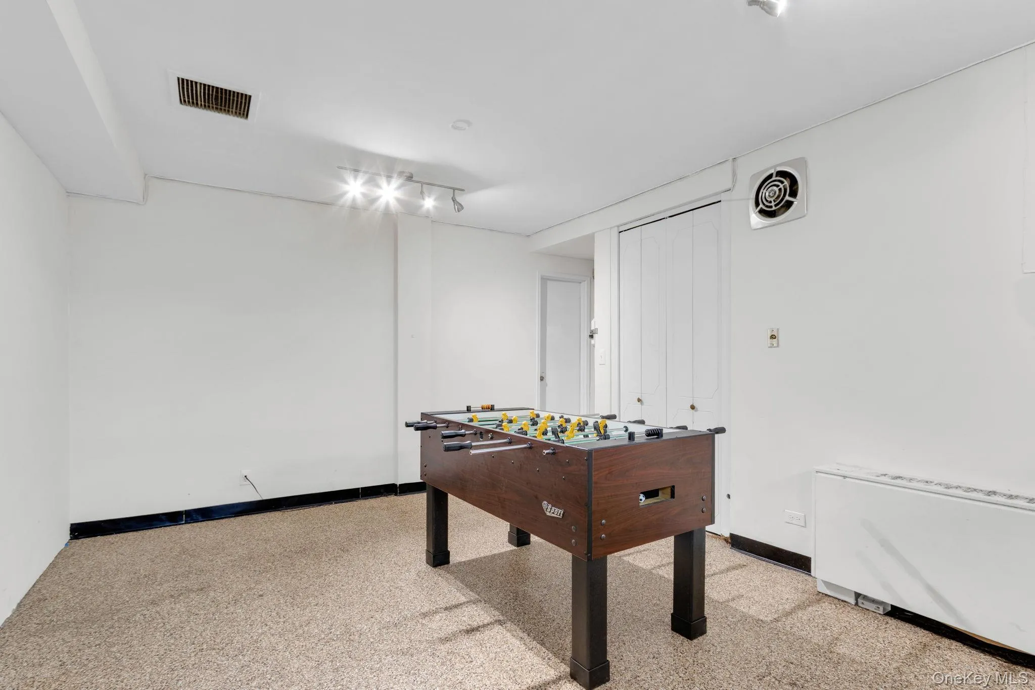 Game room featuring baseboards Game room featuring baseboards