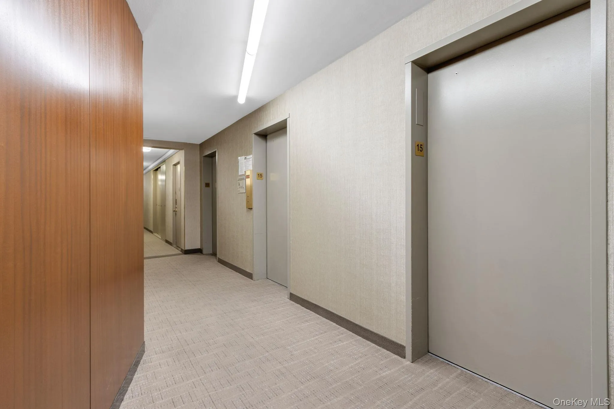 Hallway featuring elevator Hallway featuring elevator