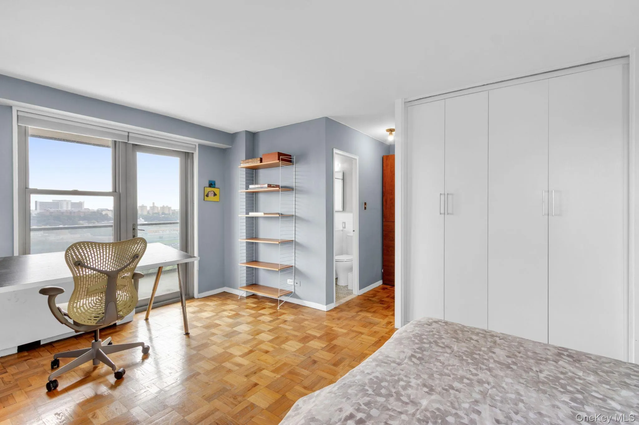 Office space with baseboards and a water view Office space with baseboards and a water view