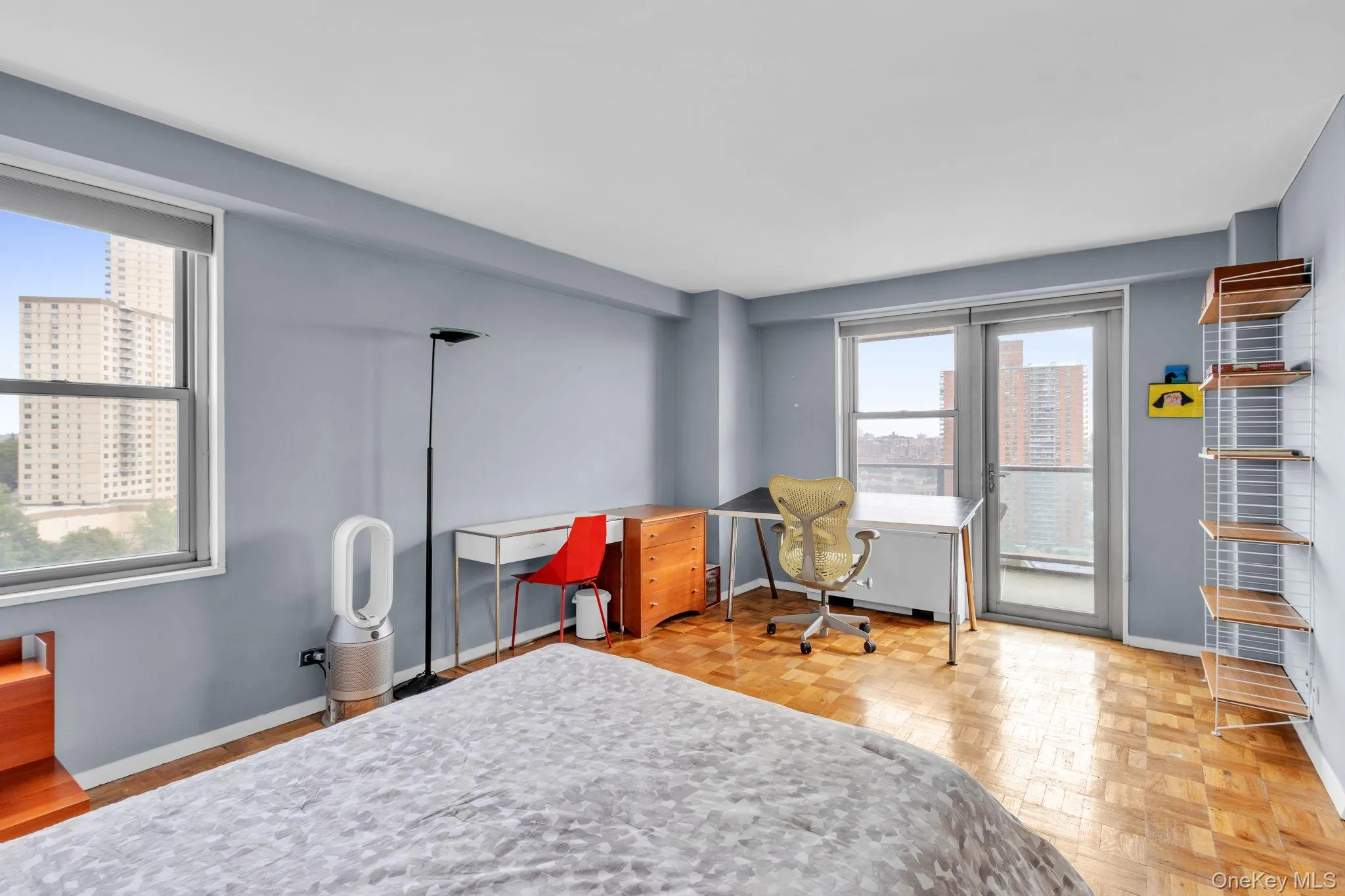 Bedroom featuring access to exterior and an office area Bedroom featuring access to exterior and an office area