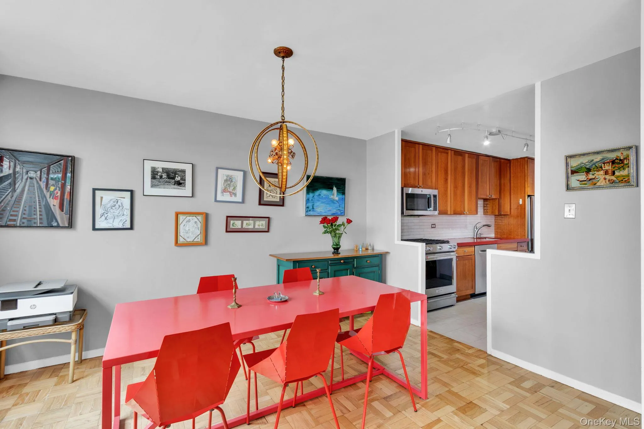 Dining room featuring a chandelier and baseboards Dining room featuring a chandelier and baseboards