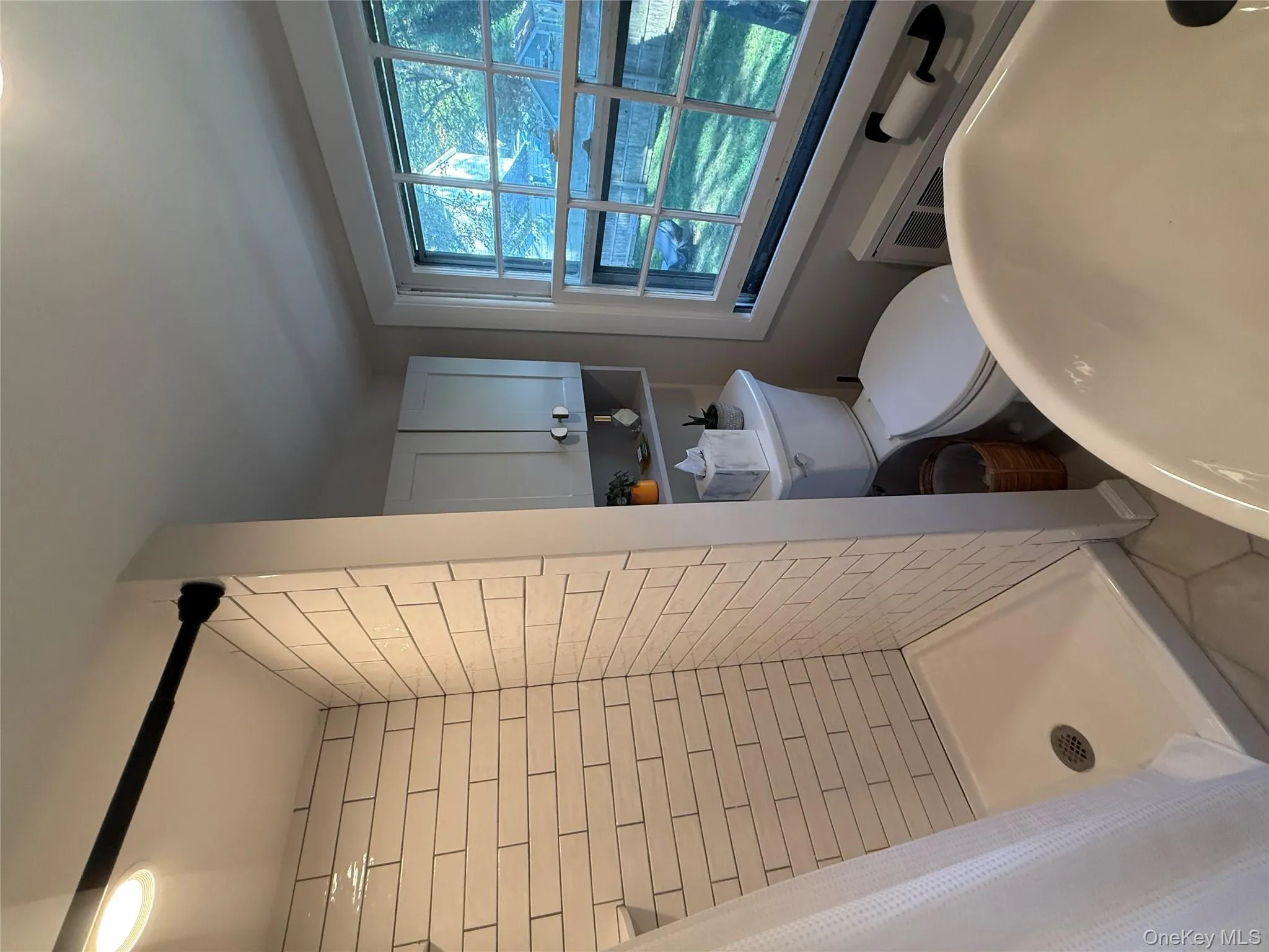 Full bath with a stall shower and toilet Full bath with a stall shower and toilet