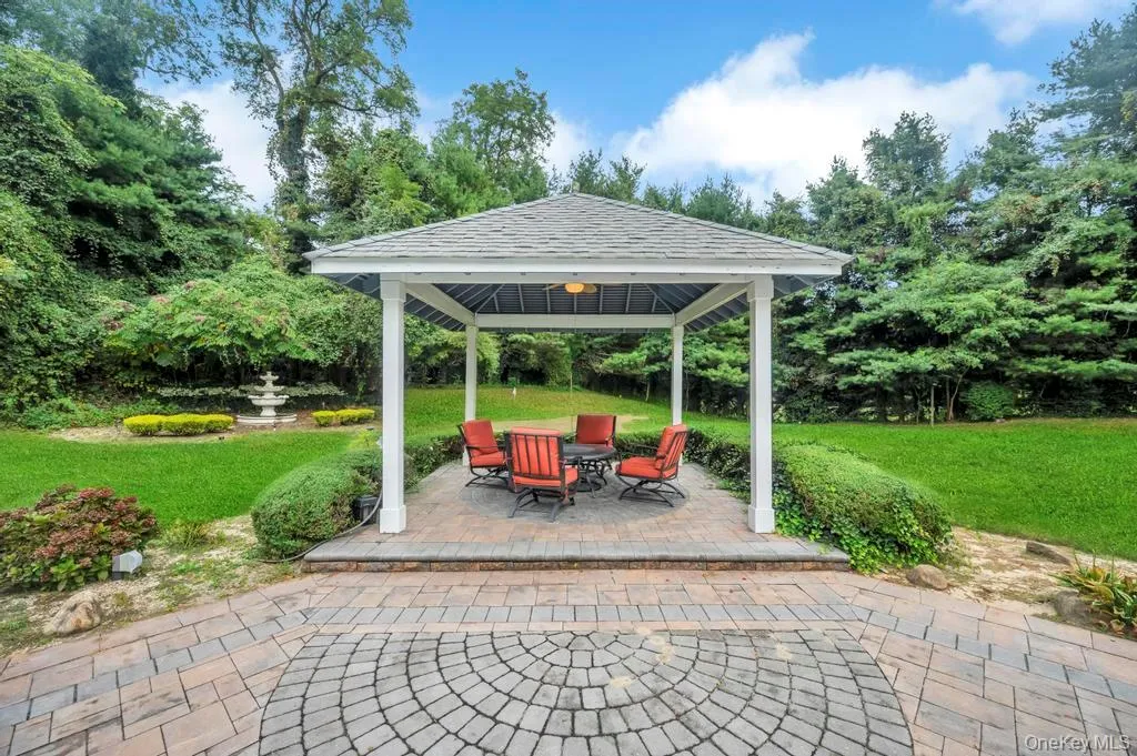 View of patio with a gazebo and view of wooded area View of patio with a gazebo and view of wooded area