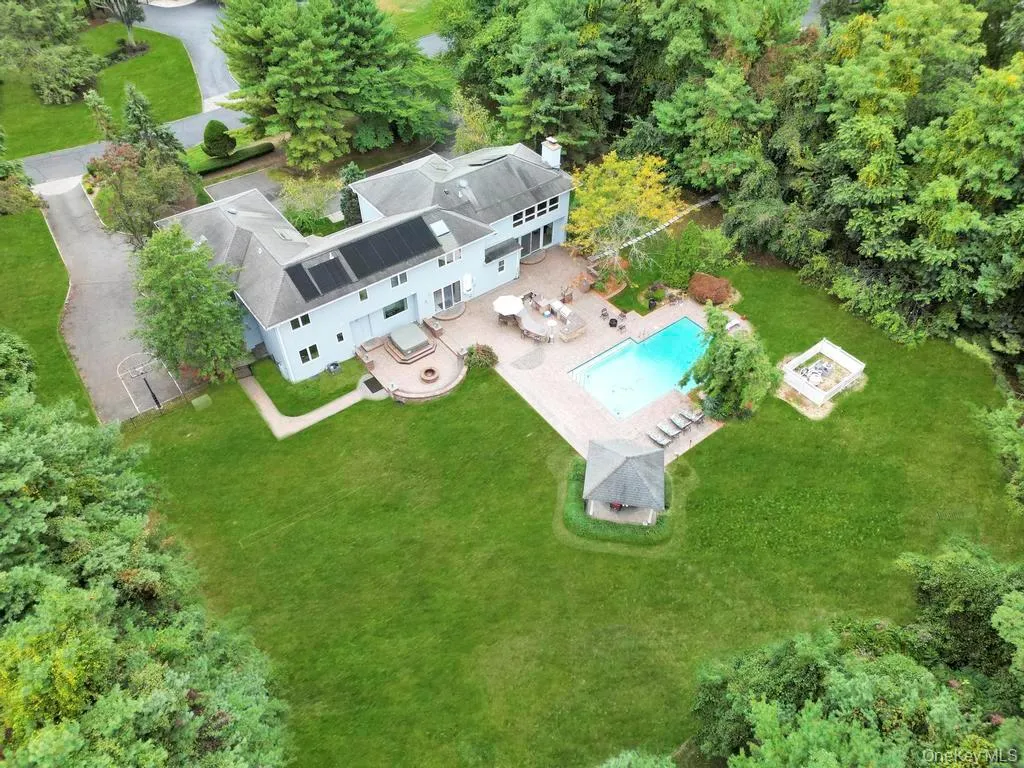 View of subject property with a pool area View of subject property with a pool area