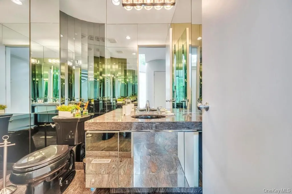 Bathroom featuring vanity and recessed lighting Bathroom featuring vanity and recessed lighting