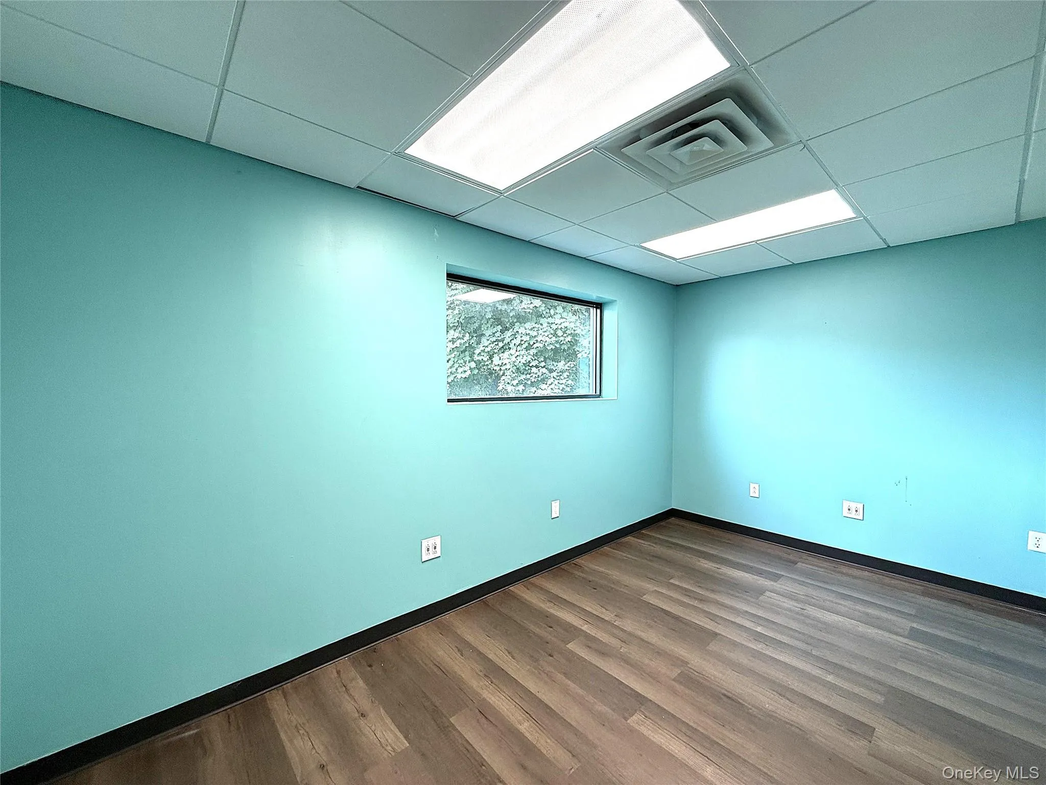 Back corner office also has a large window. Back corner office also has a large window.