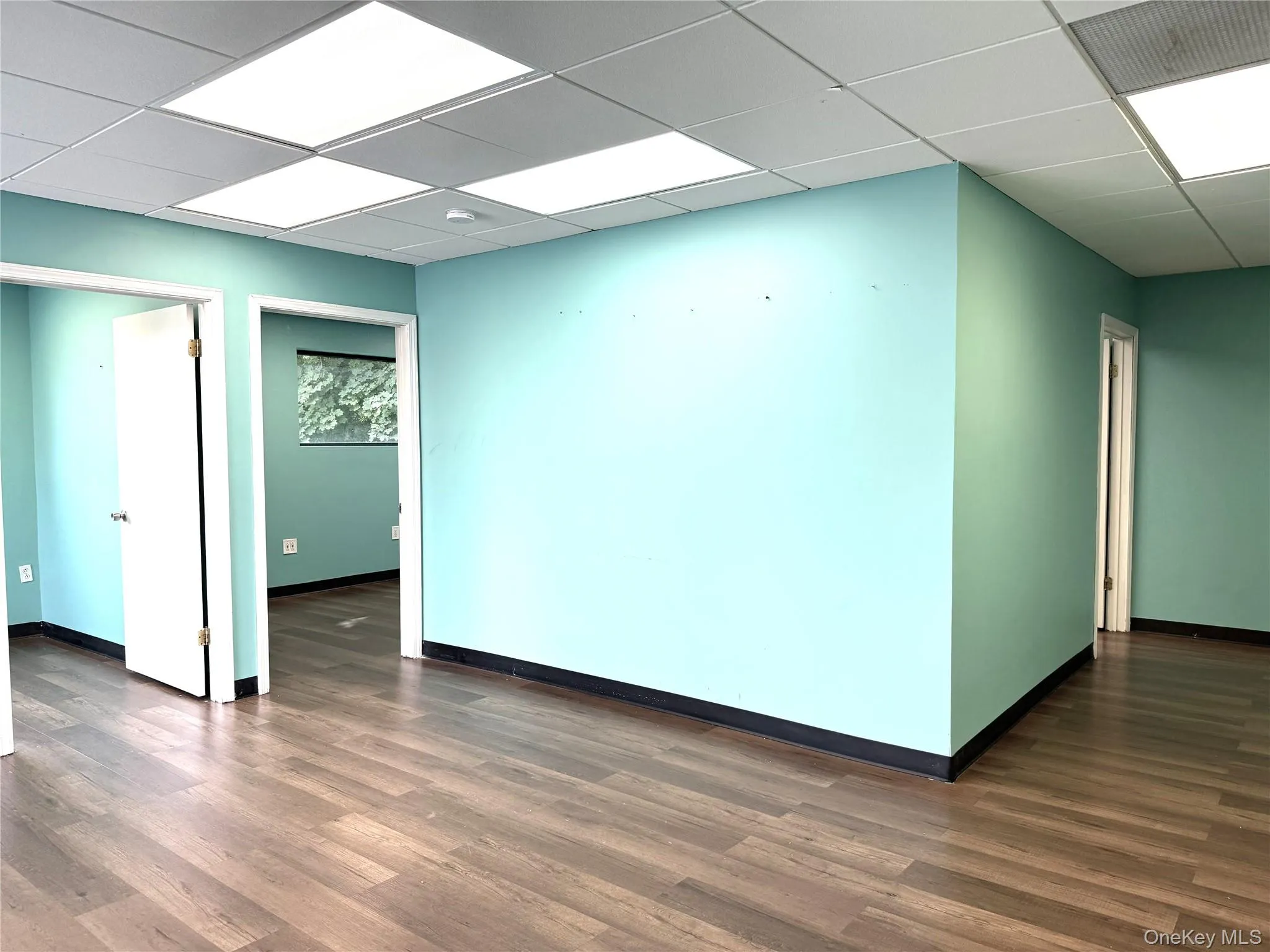 To the left of the large reception area are 2 offices. To the left of the large reception area are 2 offices.