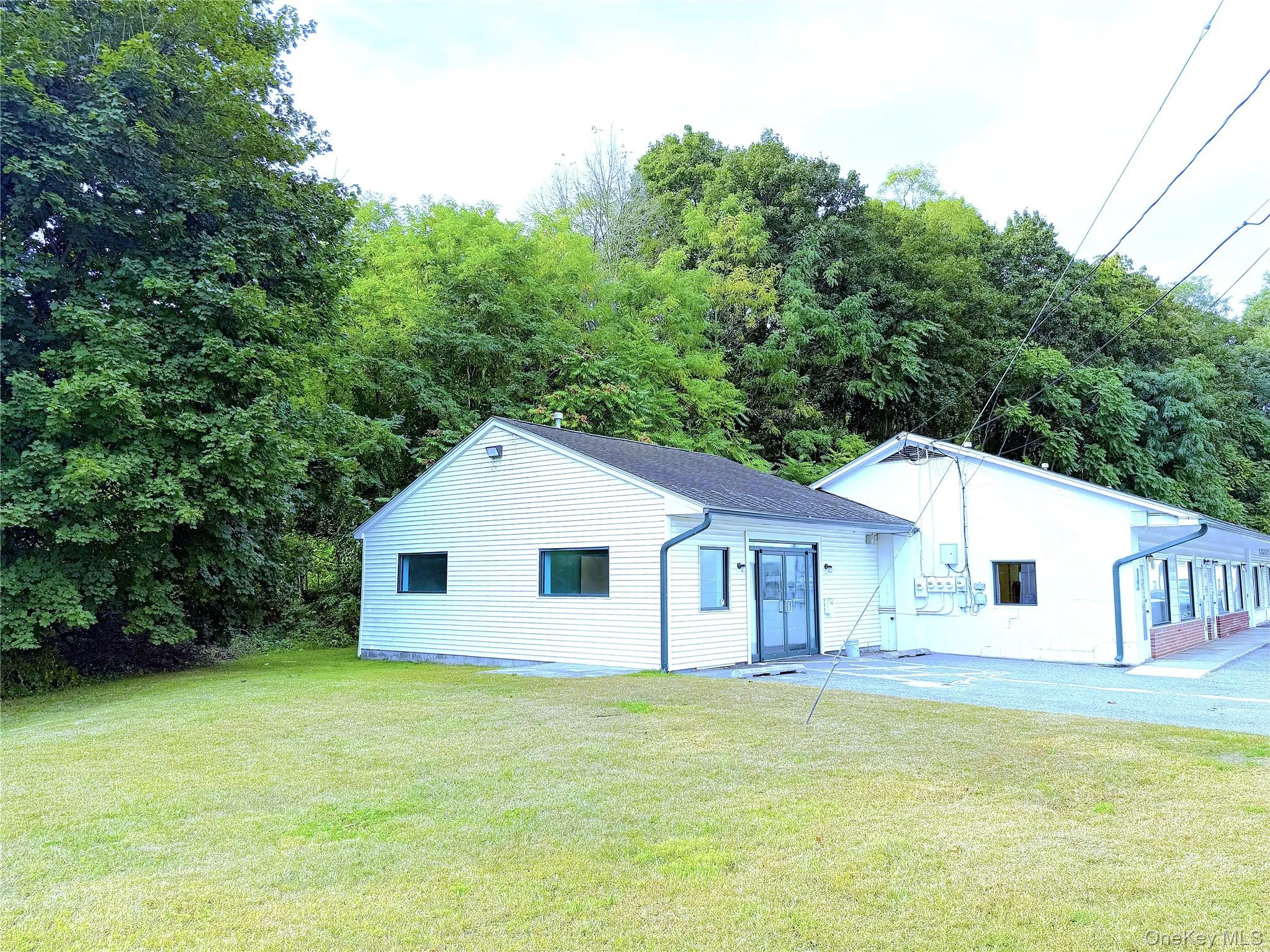 Wide entry doors open to a spacious reception room/office. 4 separate offices, and an ADA handicap bathroom and front entry. Central air, your own electric meter. Wide entry doors open to a spacious reception room/office. 4 separate offices, and an ADA handicap bathroom and front entry. Central air, your own electric meter.