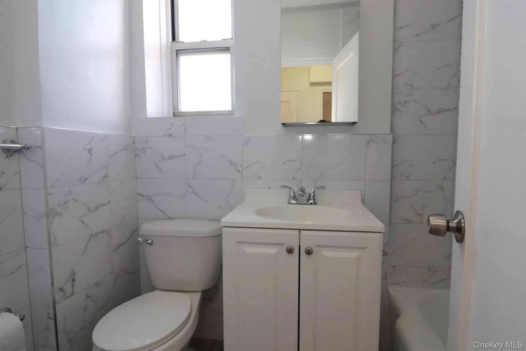 Bathroom with tile walls and vanity Bathroom with tile walls and vanity