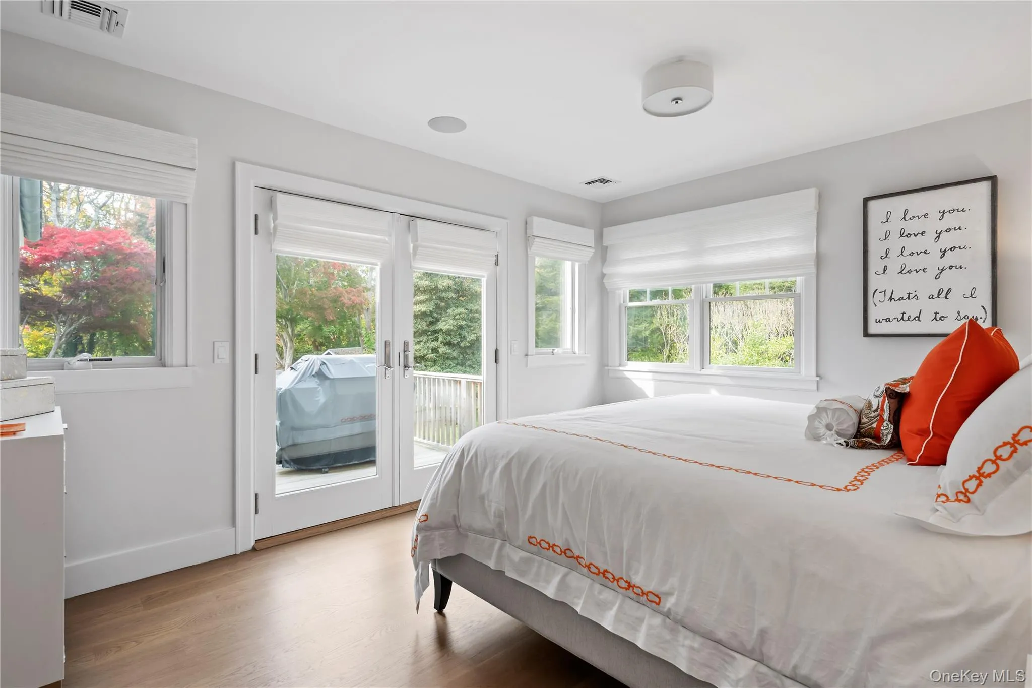 Bedroom featuring wood finished floors and access to outside