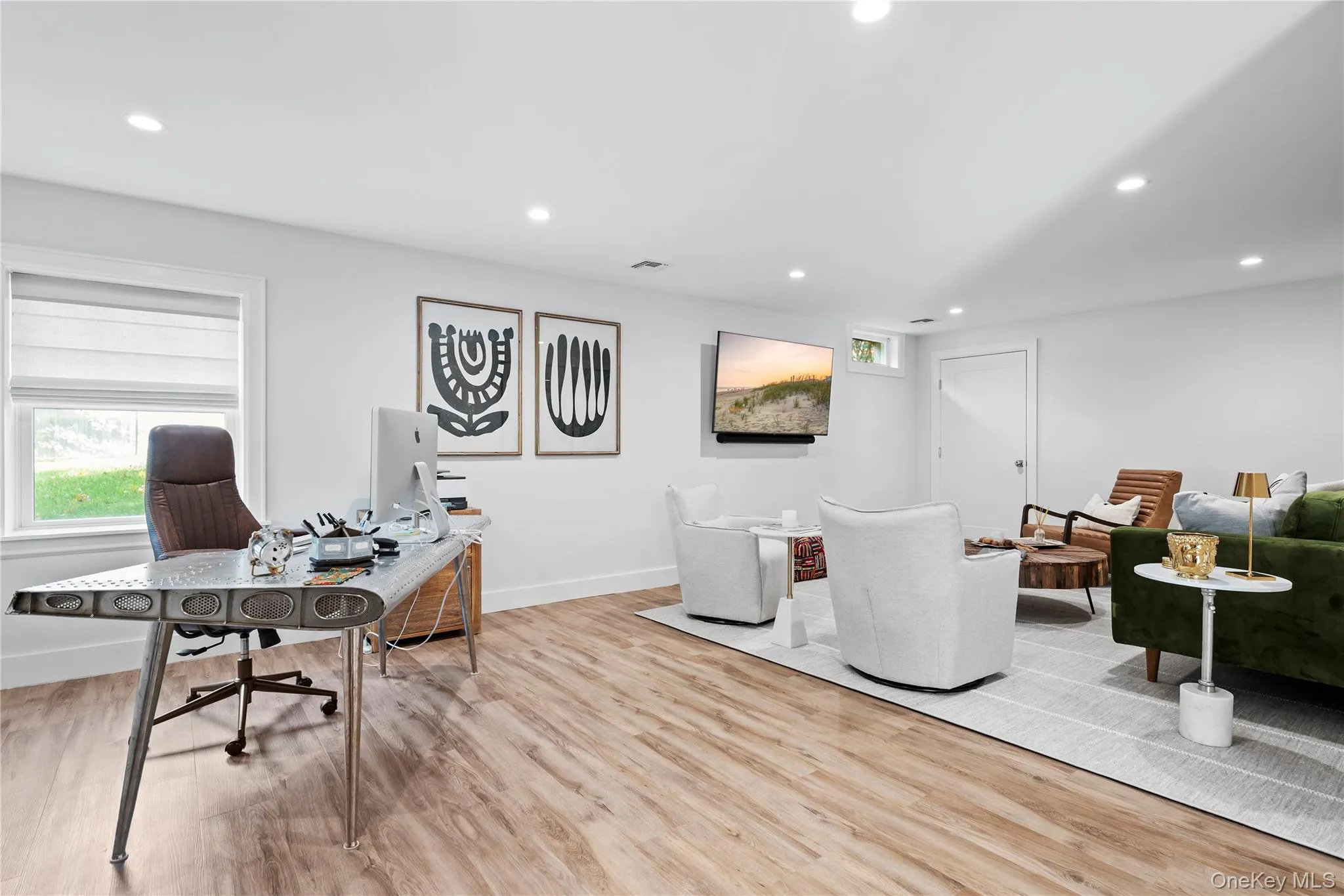 Office area with recessed lighting and light wood-style flooring