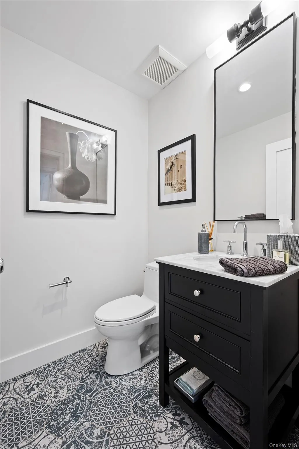 Bathroom featuring vanity and tile patterned flooring