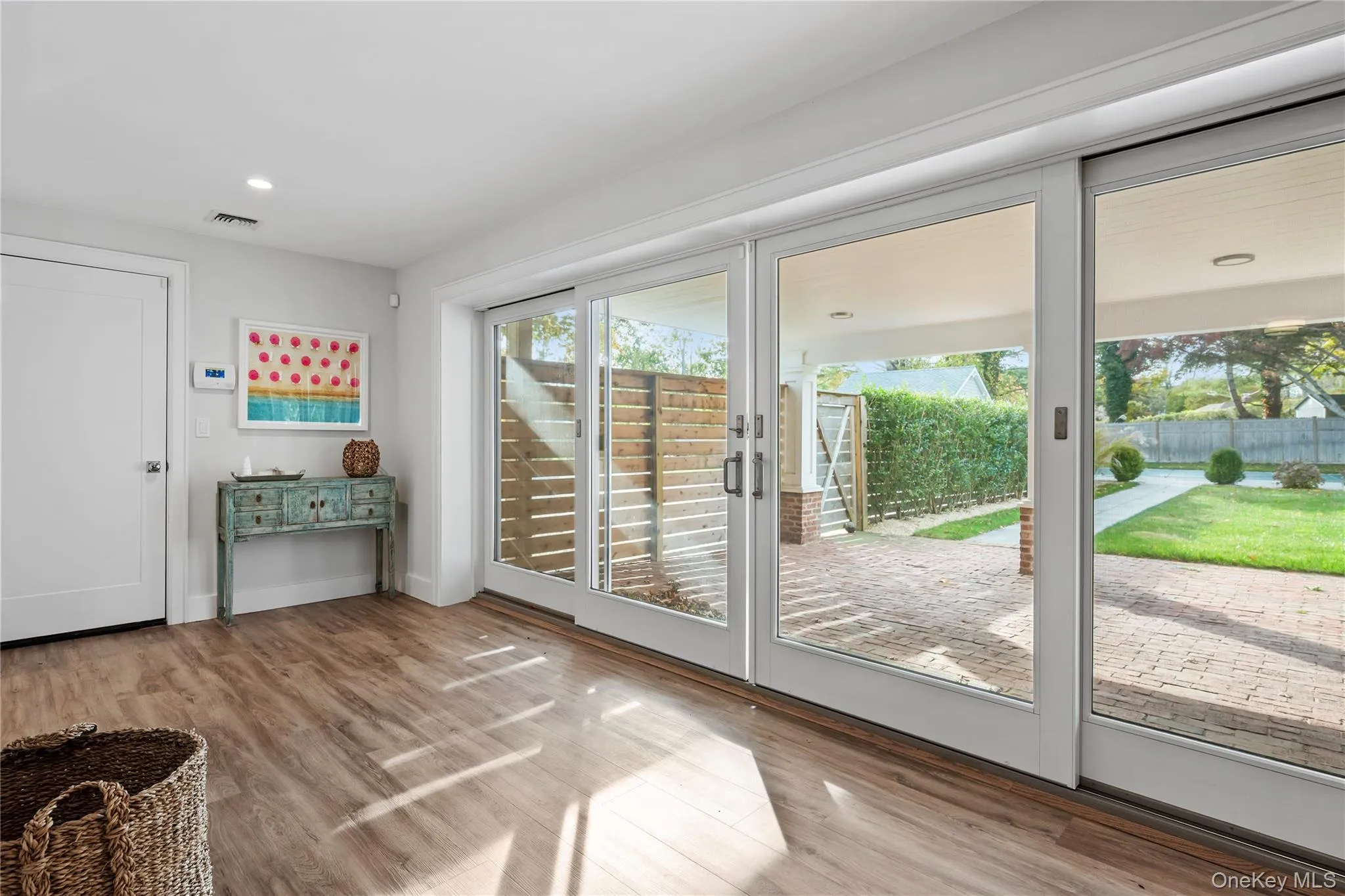 Doorway to outside featuring wood finished floors and recessed lighting