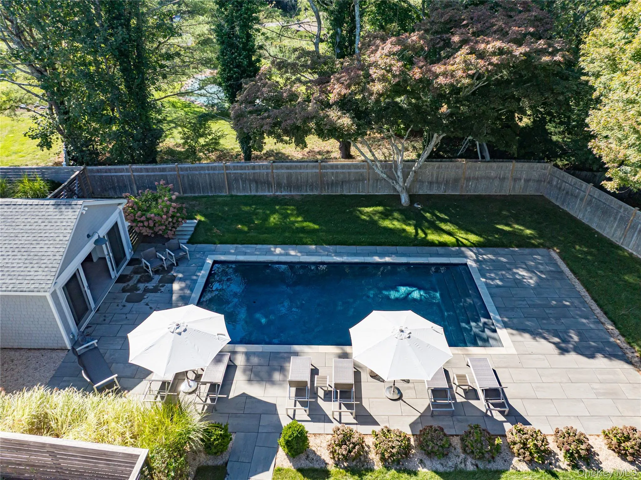 View of swimming pool featuring a patio and a fenced backyard