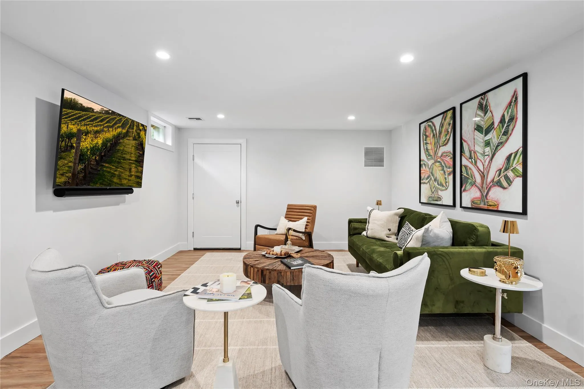 Living room with wood finished floors and recessed lighting