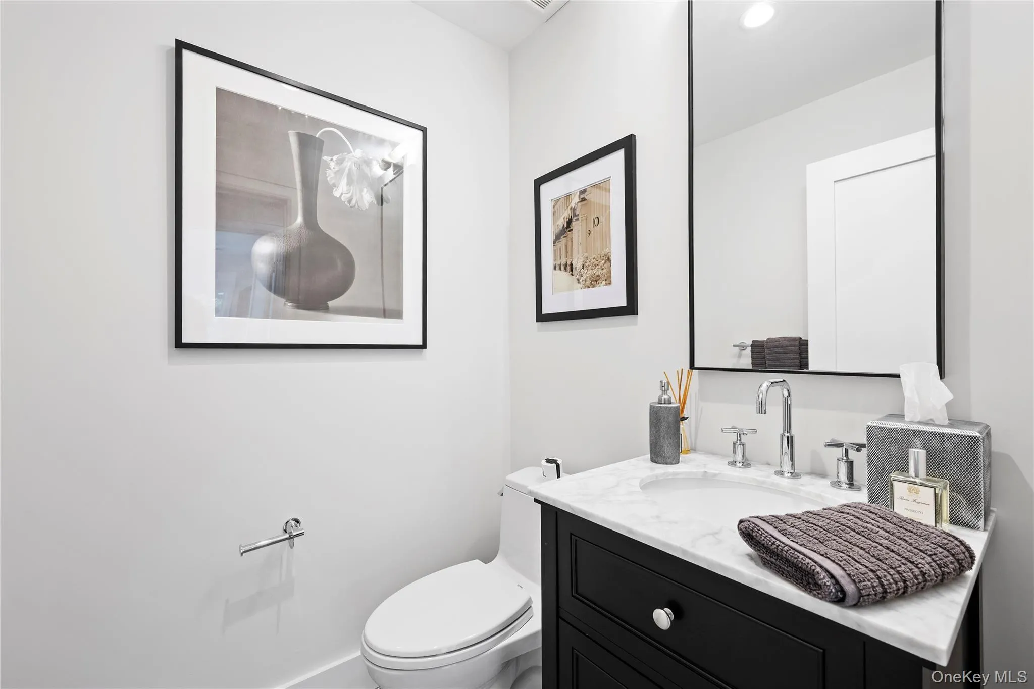 Half bath with vanity and toilet
