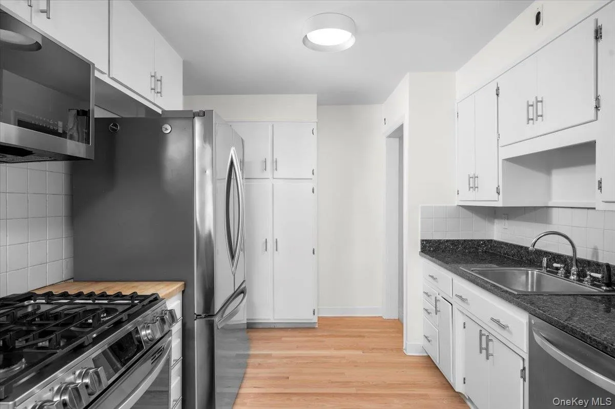 Kitchen featuring stainless appliances and natural gas cooktop/stove. Kitchen featuring stainless appliances and natural gas cooktop/stove.