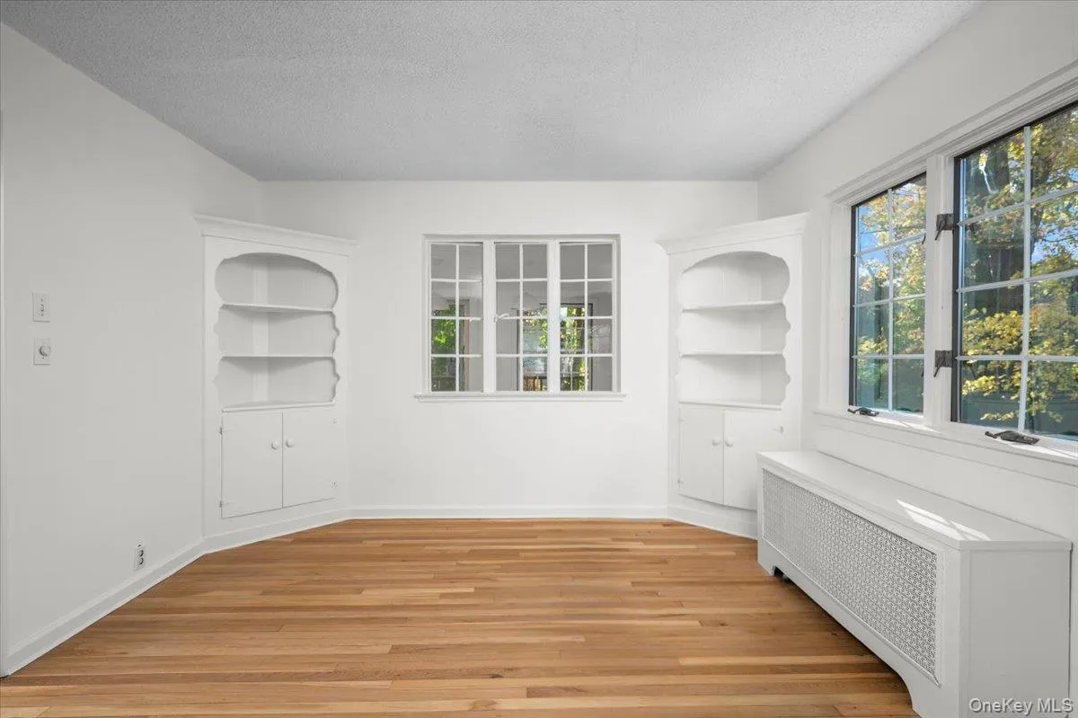 Light-filled dining room with built-ins. Conveniently located off the kitchen. Light-filled dining room with built-ins. Conveniently located off the kitchen.