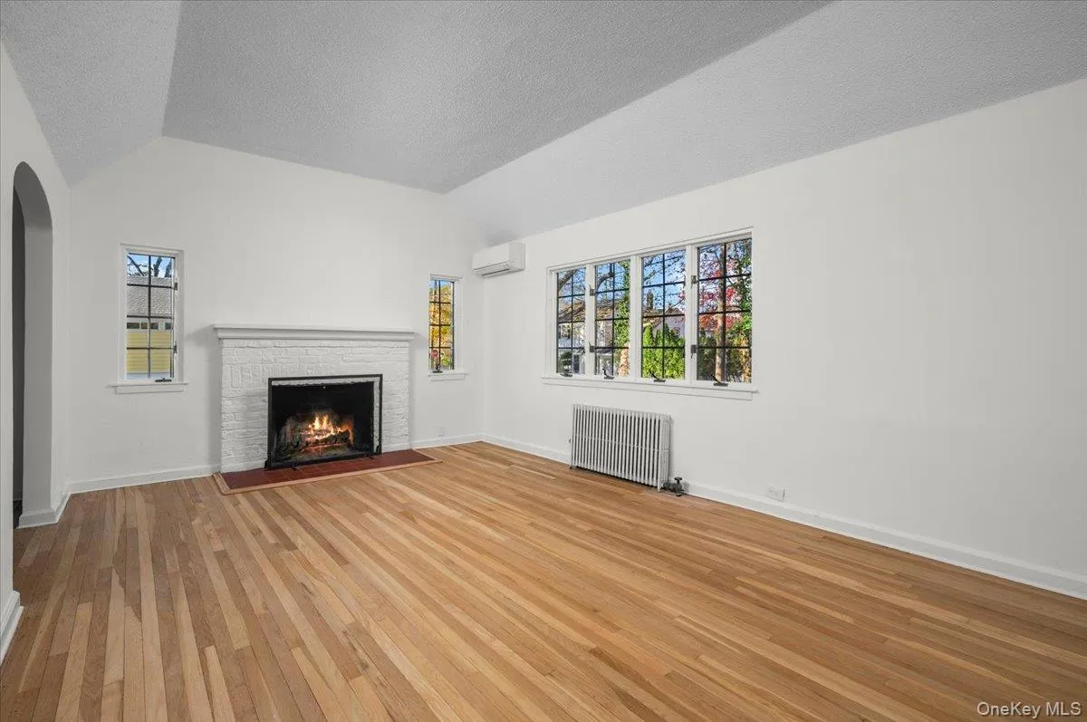 Living room with wood burning fireplace. Living room with wood burning fireplace.