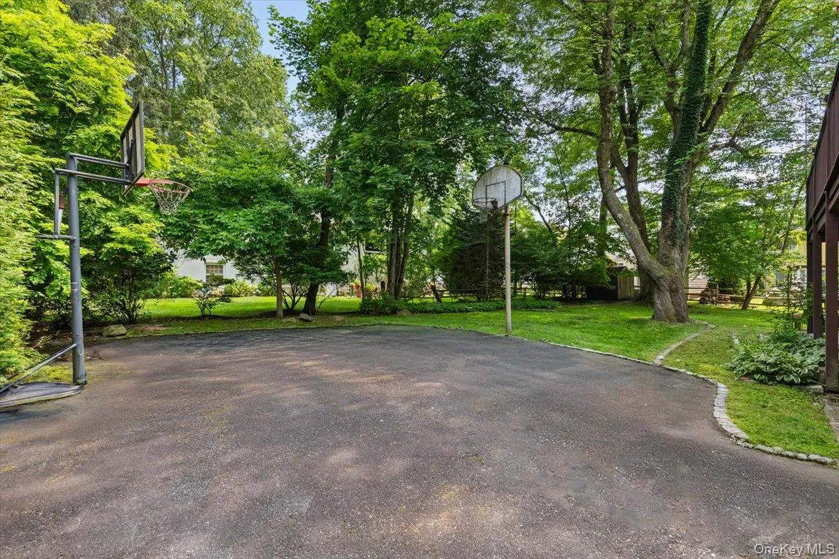 The large driveway will hold multiple cars. The large driveway will hold multiple cars.