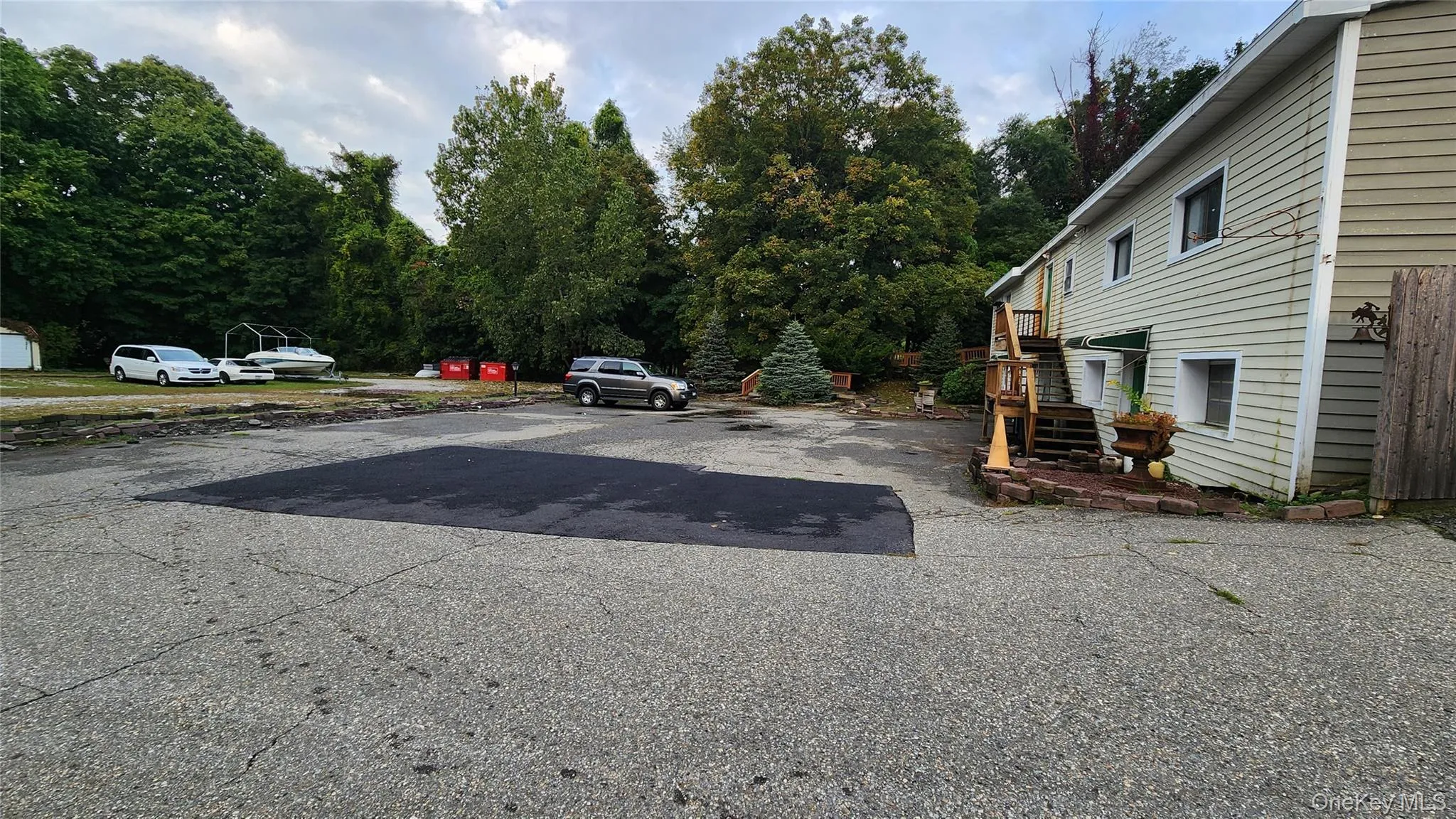 View of parking with stairway View of parking with stairway