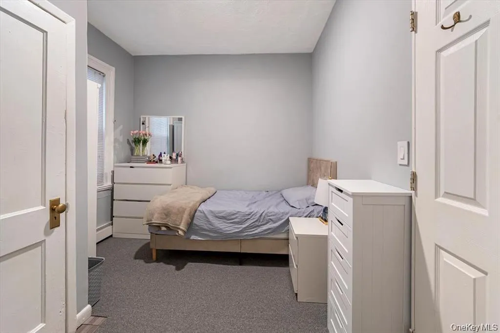 Bedroom with carpet flooring Bedroom with carpet flooring