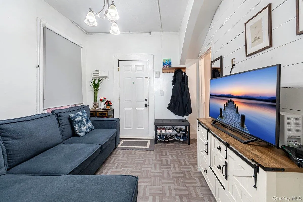 Living area featuring a chandelier Living area featuring a chandelier