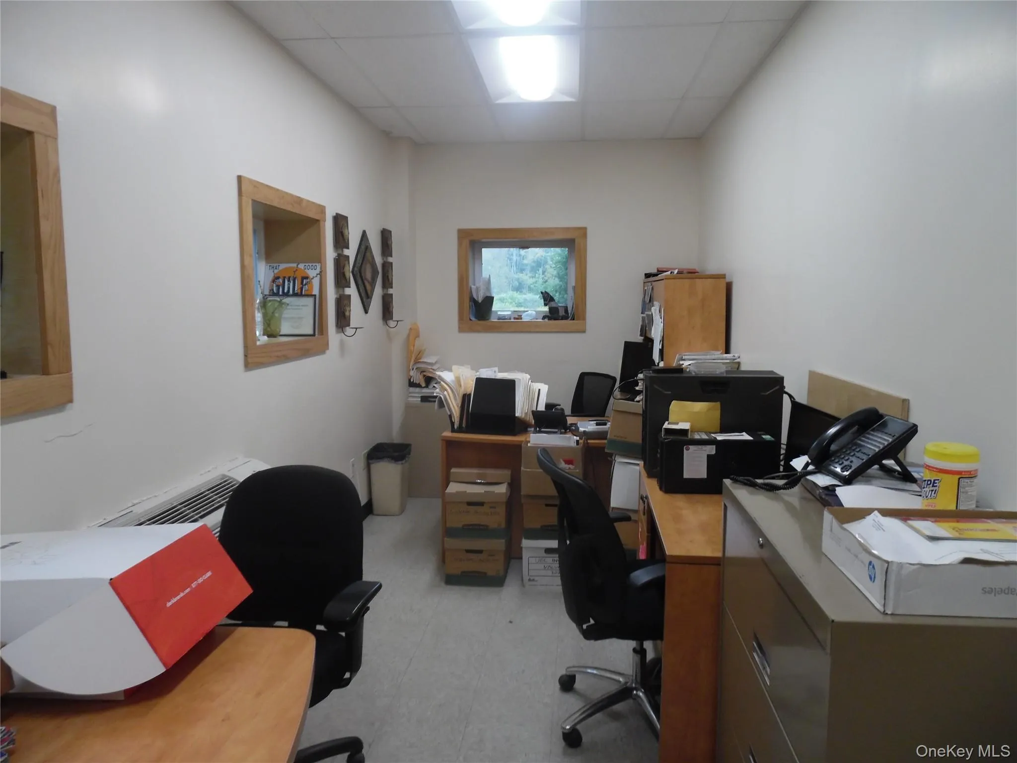 Office with a paneled ceiling Office with a paneled ceiling