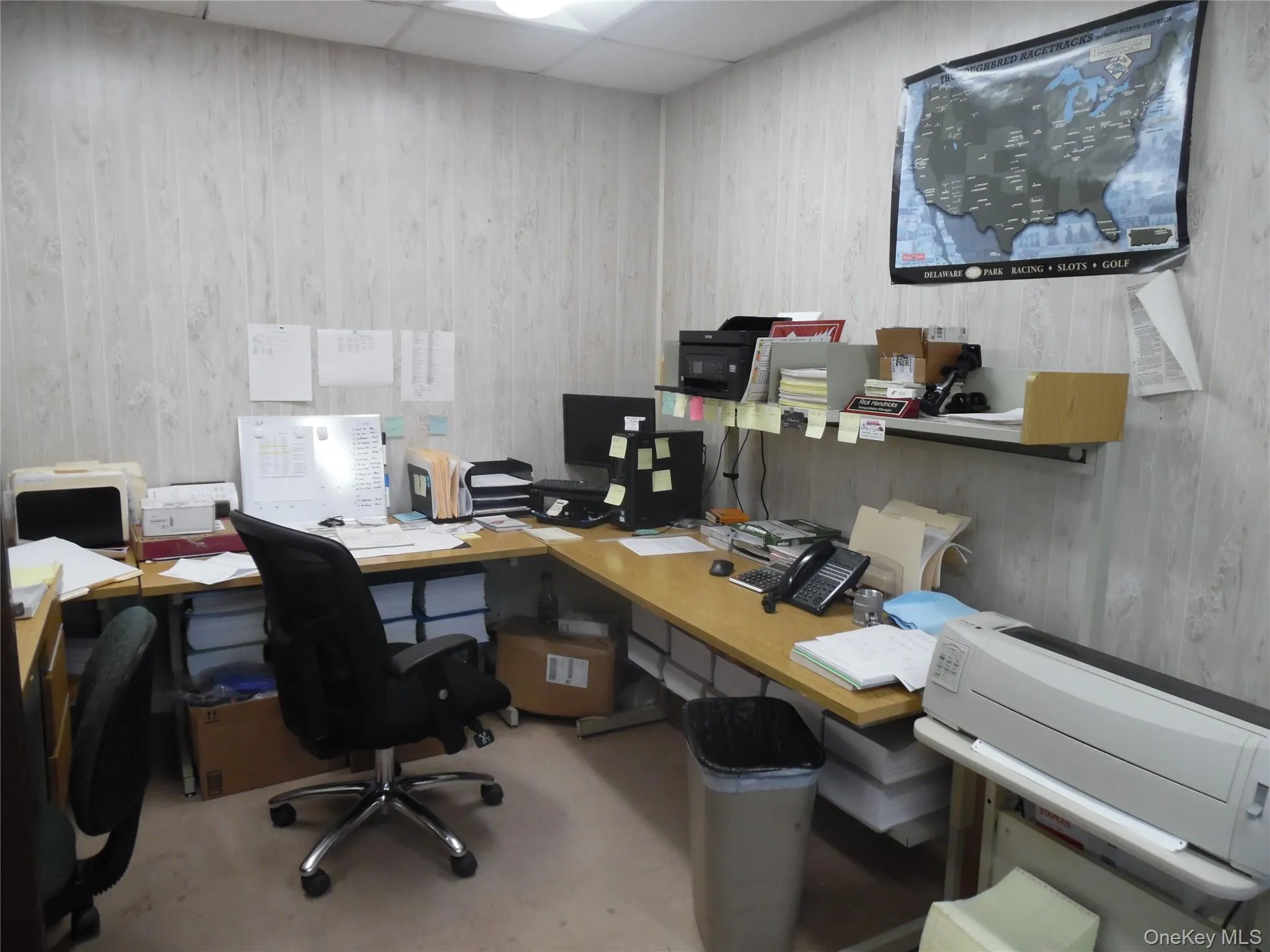 Office area featuring a drop ceiling Office area featuring a drop ceiling