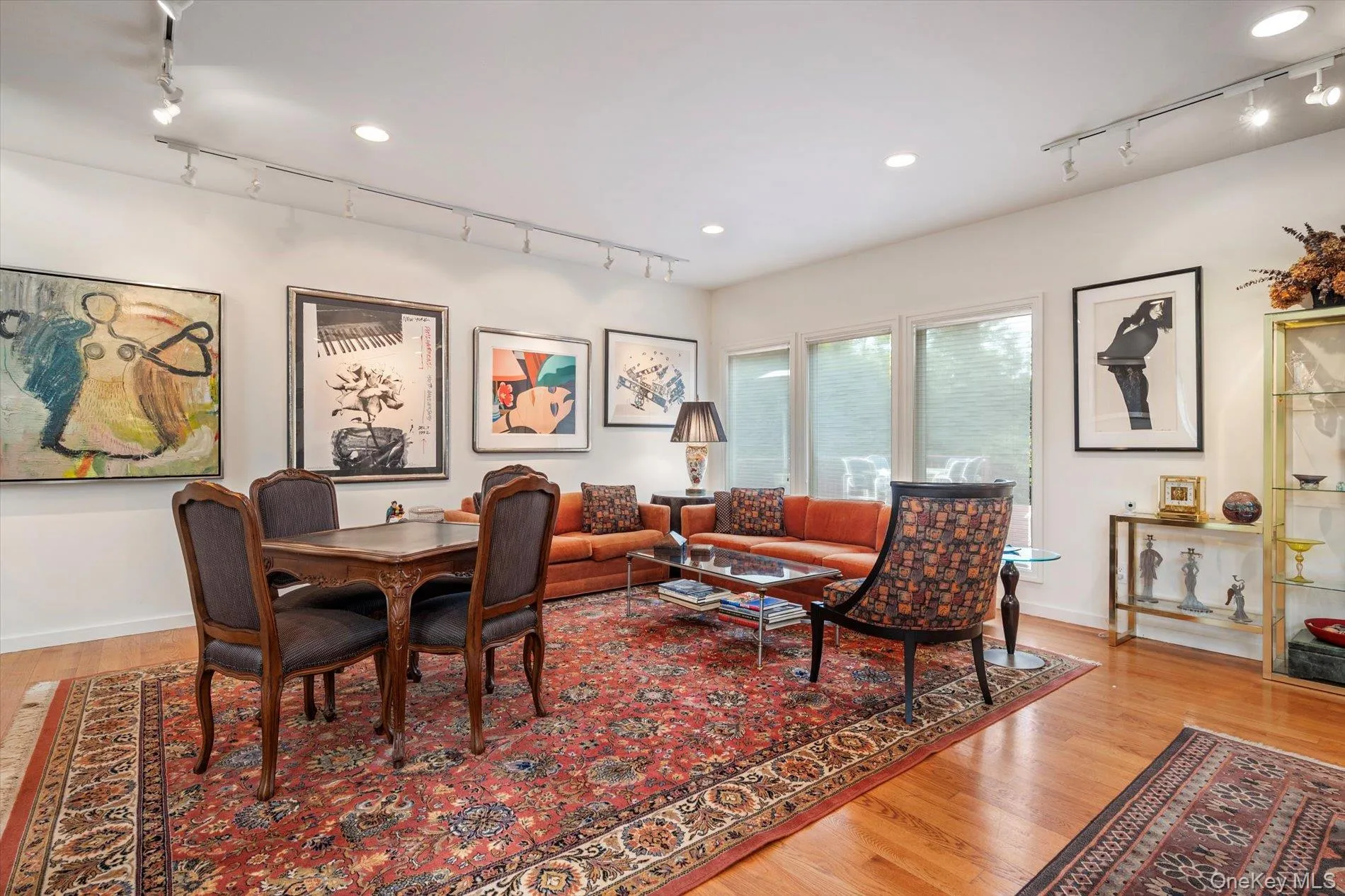 Dining space featuring track lighting, light wood-type flooring, and recessed lighting Dining space featuring track lighting, light wood-type flooring, and recessed lighting