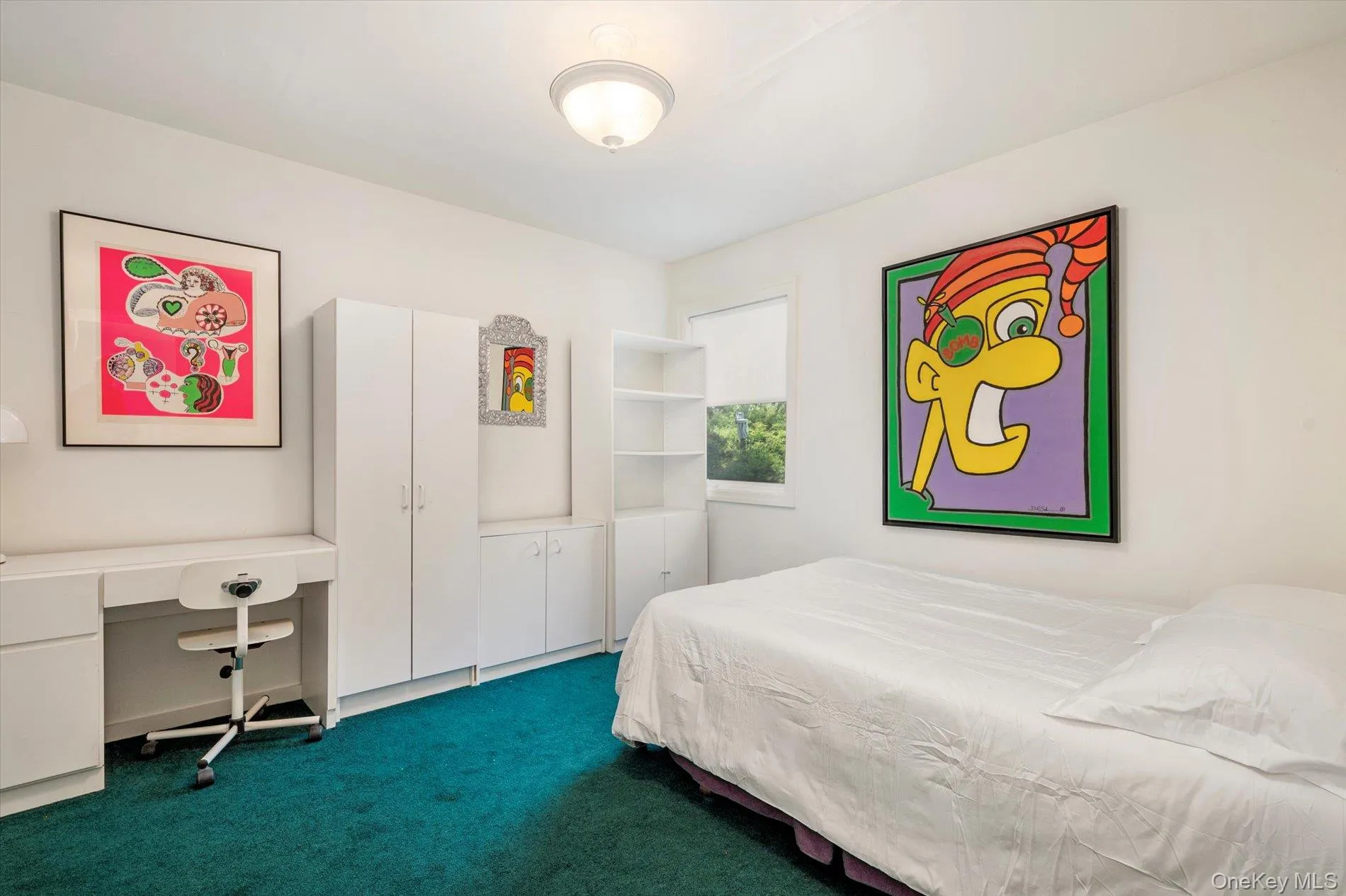 Bedroom featuring dark colored carpet and a desk Bedroom featuring dark colored carpet and a desk