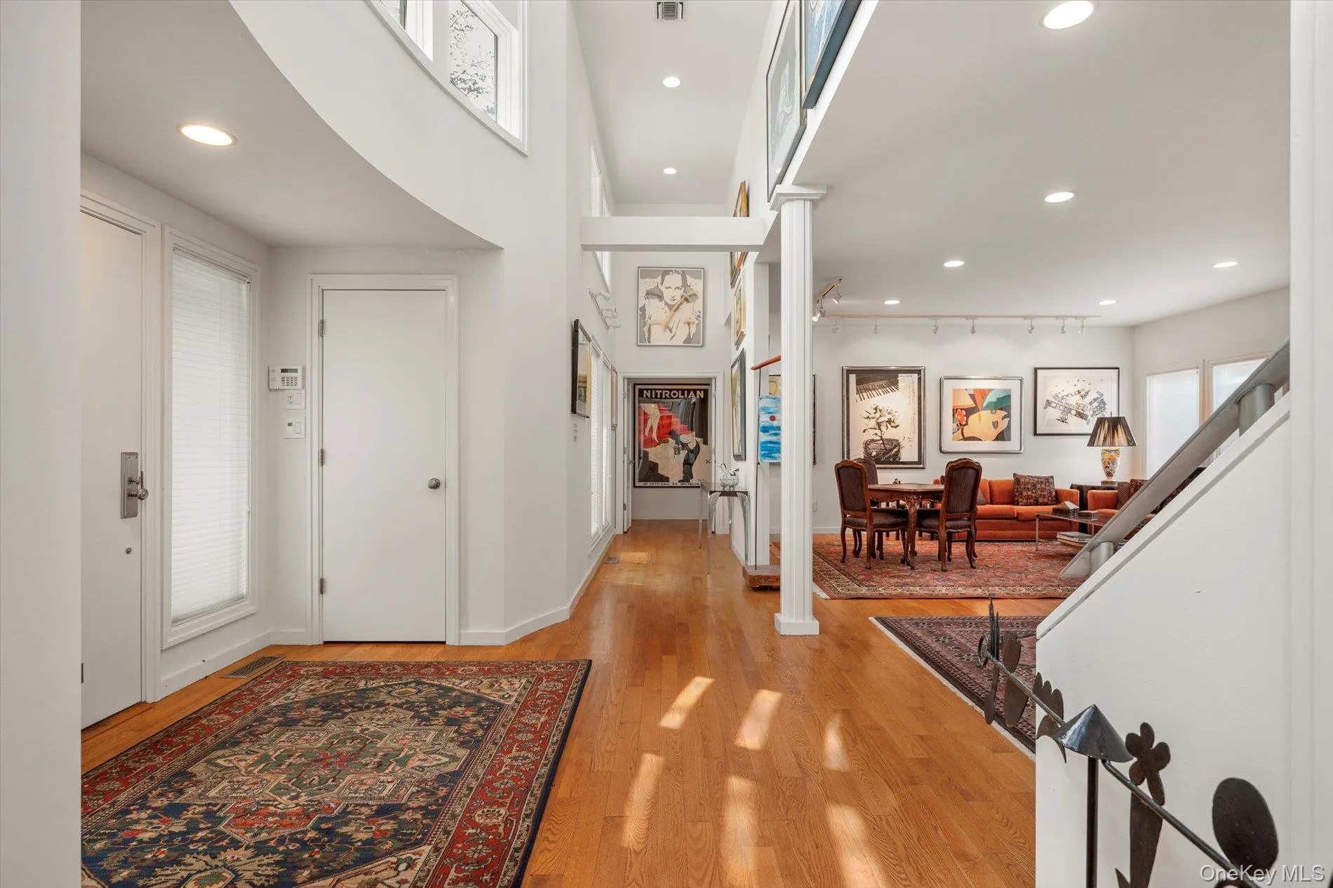 Entrance foyer with recessed lighting, plenty of natural light, and light wood-style flooring Entrance foyer with recessed lighting, plenty of natural light, and light wood-style flooring