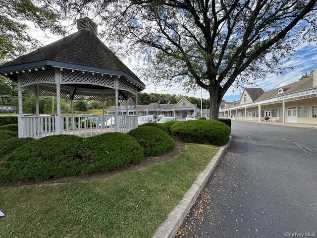 Entryway featuring a gazebo and a lawn Entryway featuring a gazebo and a lawn