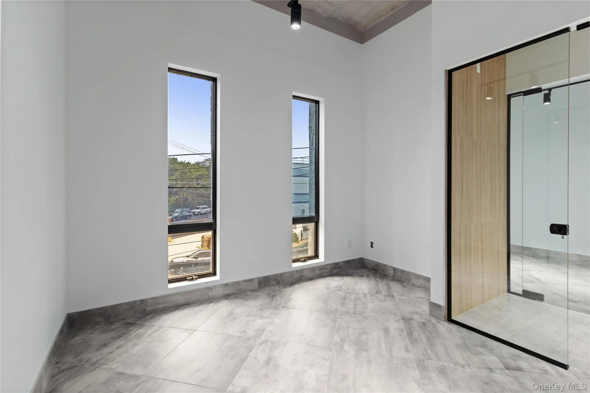 Unfurnished bedroom featuring a closet and light tile patterned flooring Unfurnished bedroom featuring a closet and light tile patterned flooring