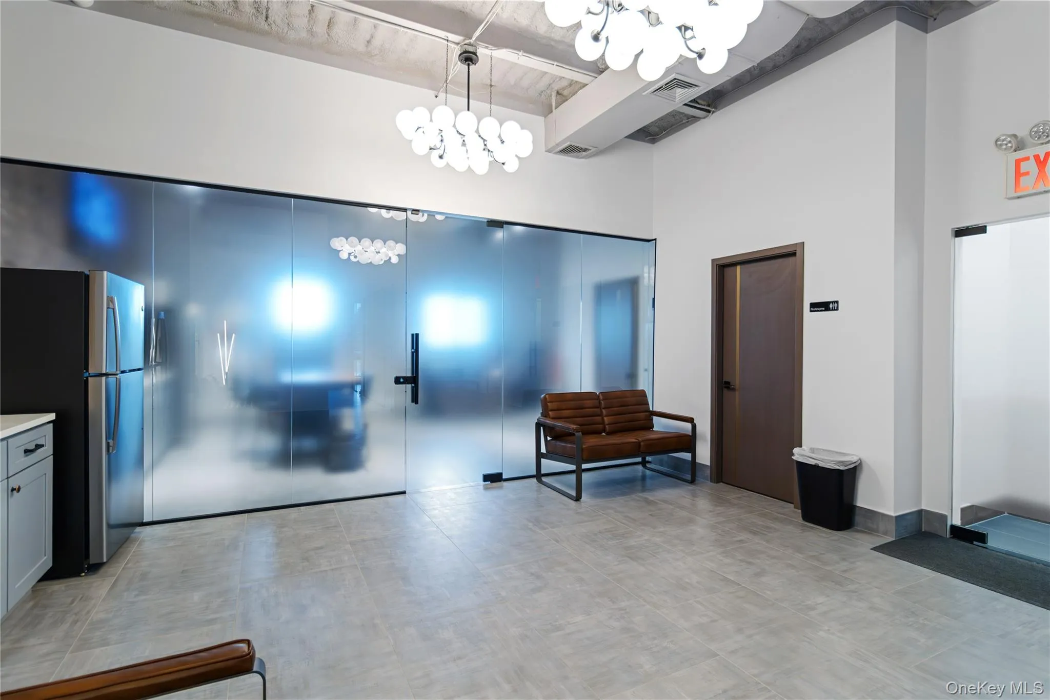 Community lobby featuring a high ceiling and beam ceiling Community lobby featuring a high ceiling and beam ceiling