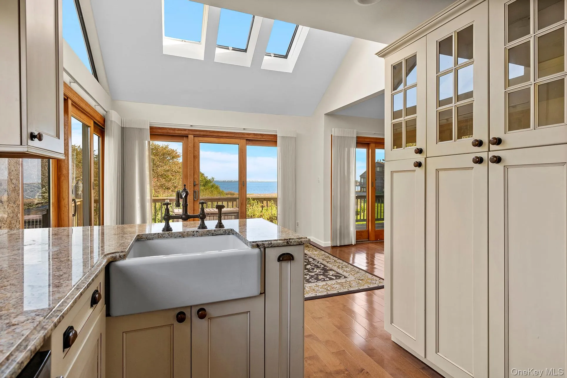 Kitchen with natural light vaulted ceiling and skylights Kitchen with natural light vaulted ceiling and skylights