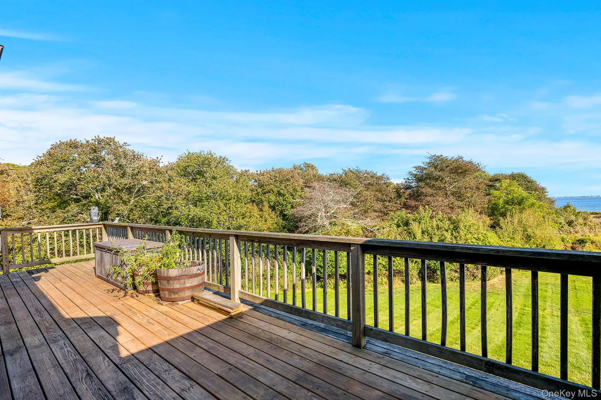 Huge deck out to the community property onto Harts Cove and Moriches Bay. Huge deck out to the community property onto Harts Cove and Moriches Bay.