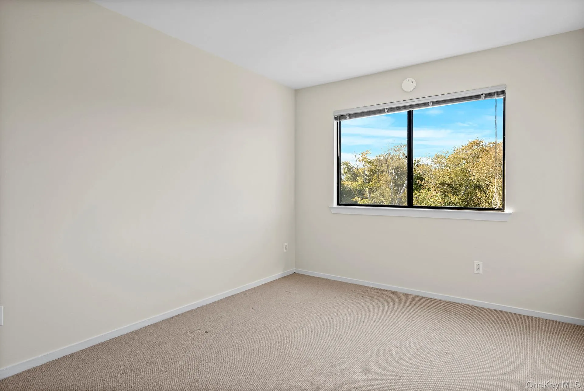 Bedroom 1 with beige colored carpet Bedroom 1 with beige colored carpet