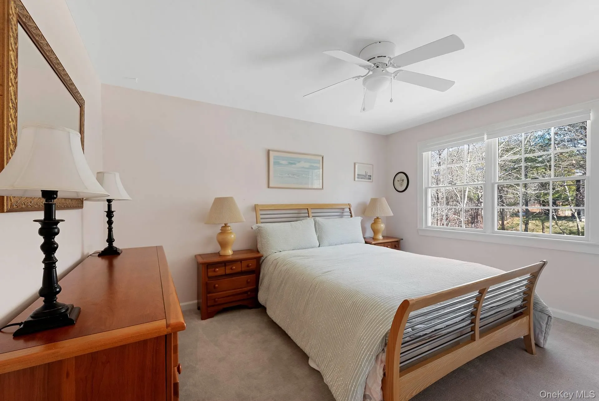 Bedroom featuring carpet and ceiling fan Bedroom featuring carpet and ceiling fan