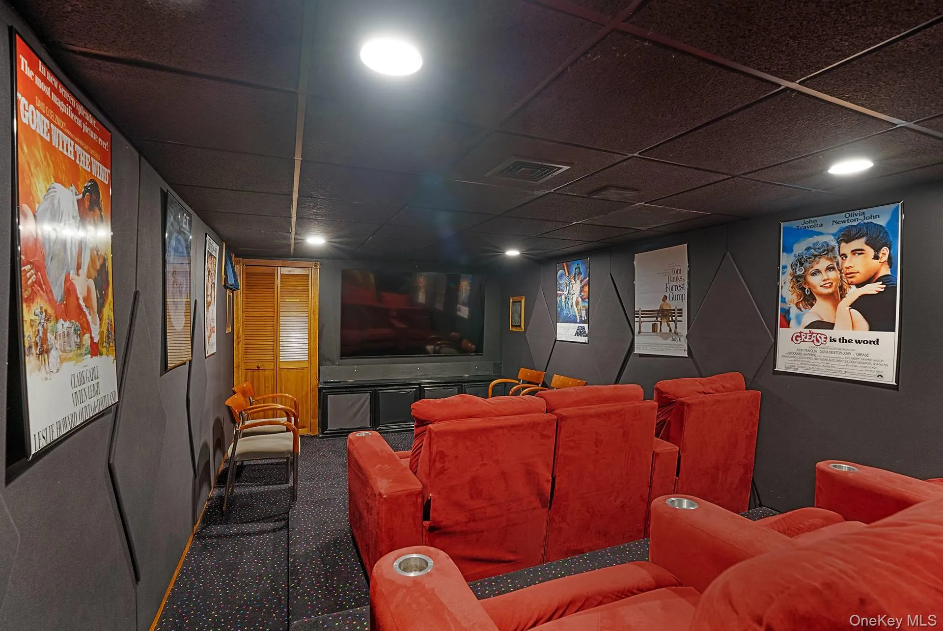 Home theater with a drop ceiling, carpet floors, and recessed lighting Home theater with a drop ceiling, carpet floors, and recessed lighting