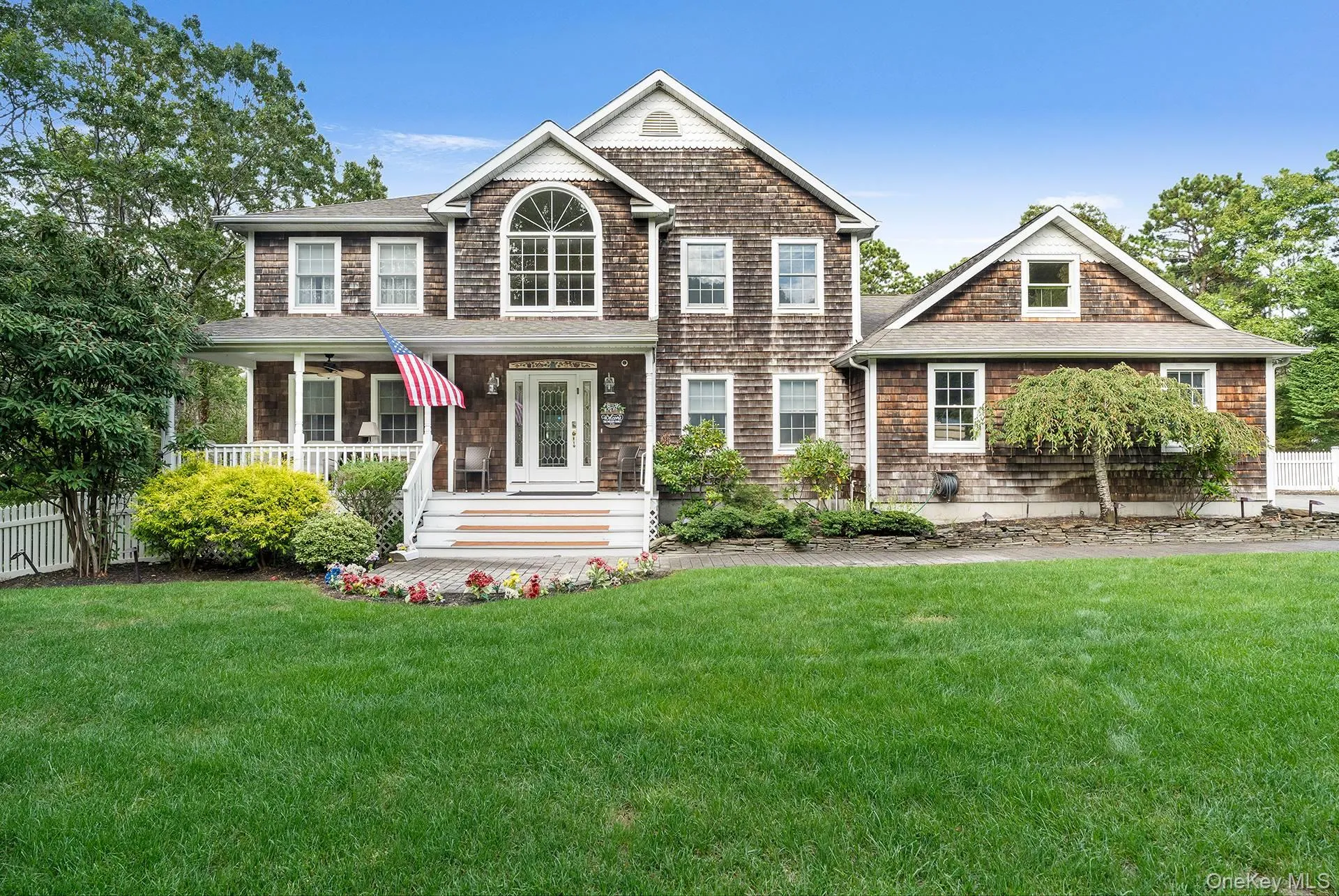 View of front facade with a porch and roof with shingles View of front facade with a porch and roof with shingles