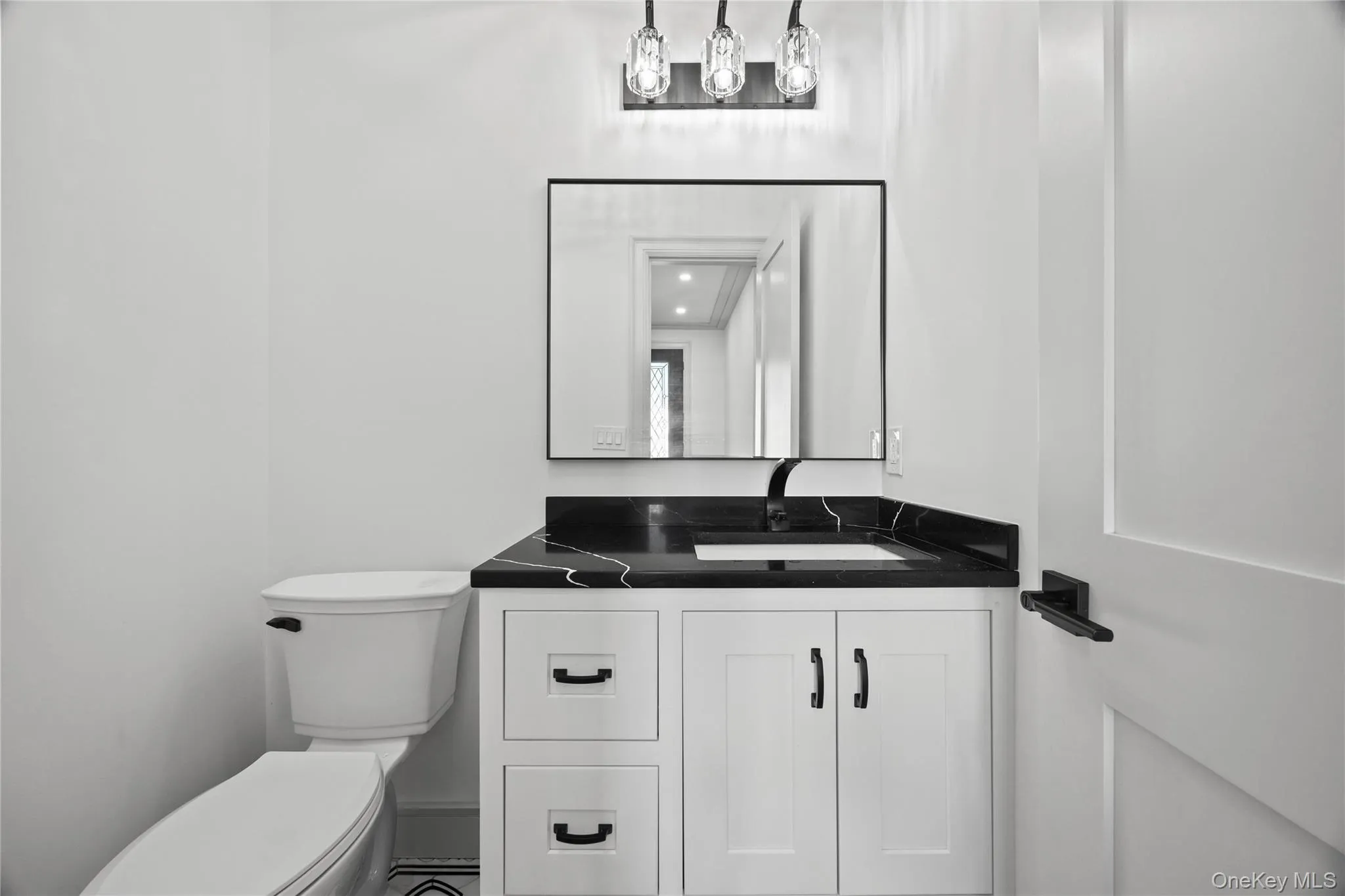 Bathroom featuring vanity and toilet Bathroom featuring vanity and toilet