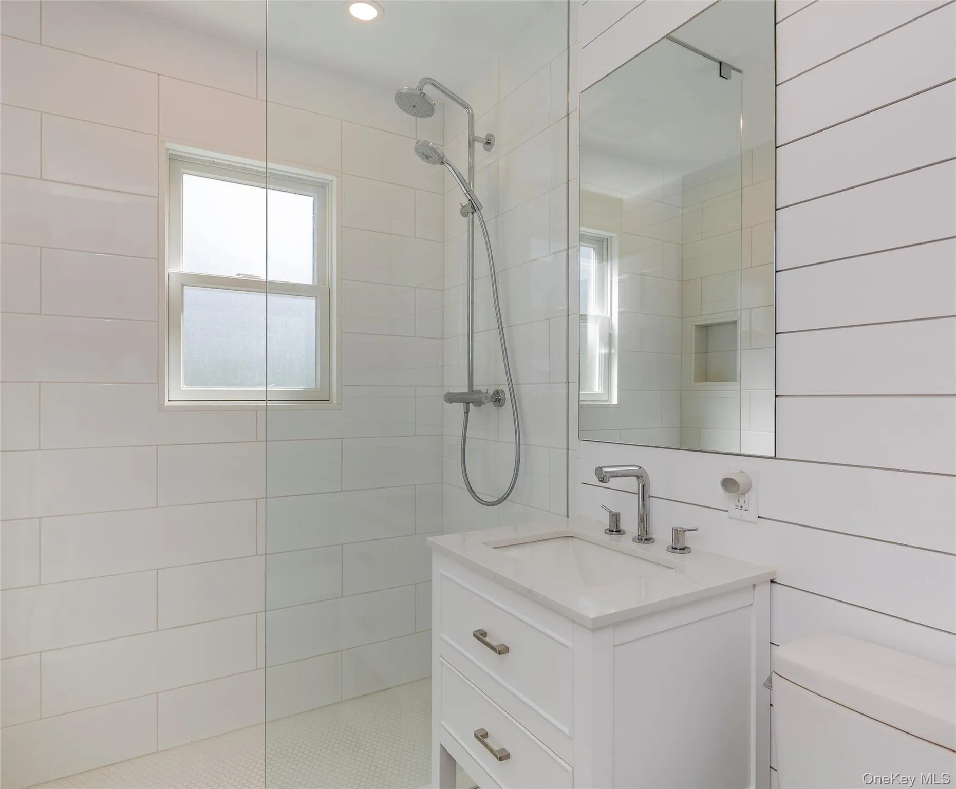 Full bath featuring vanity and walk in shower Full bath featuring vanity and walk in shower