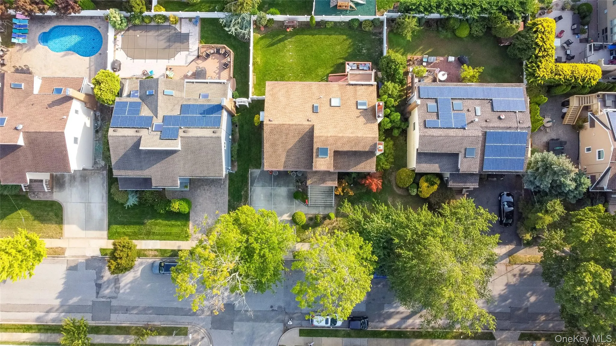 Aerial perspective of suburban area with a pool Aerial perspective of suburban area with a pool