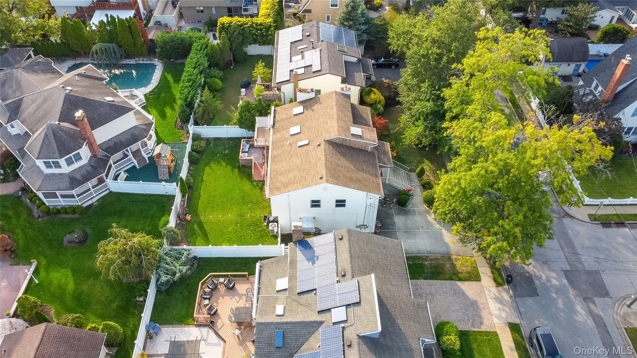 Aerial perspective of suburban area with a pool area Aerial perspective of suburban area with a pool area