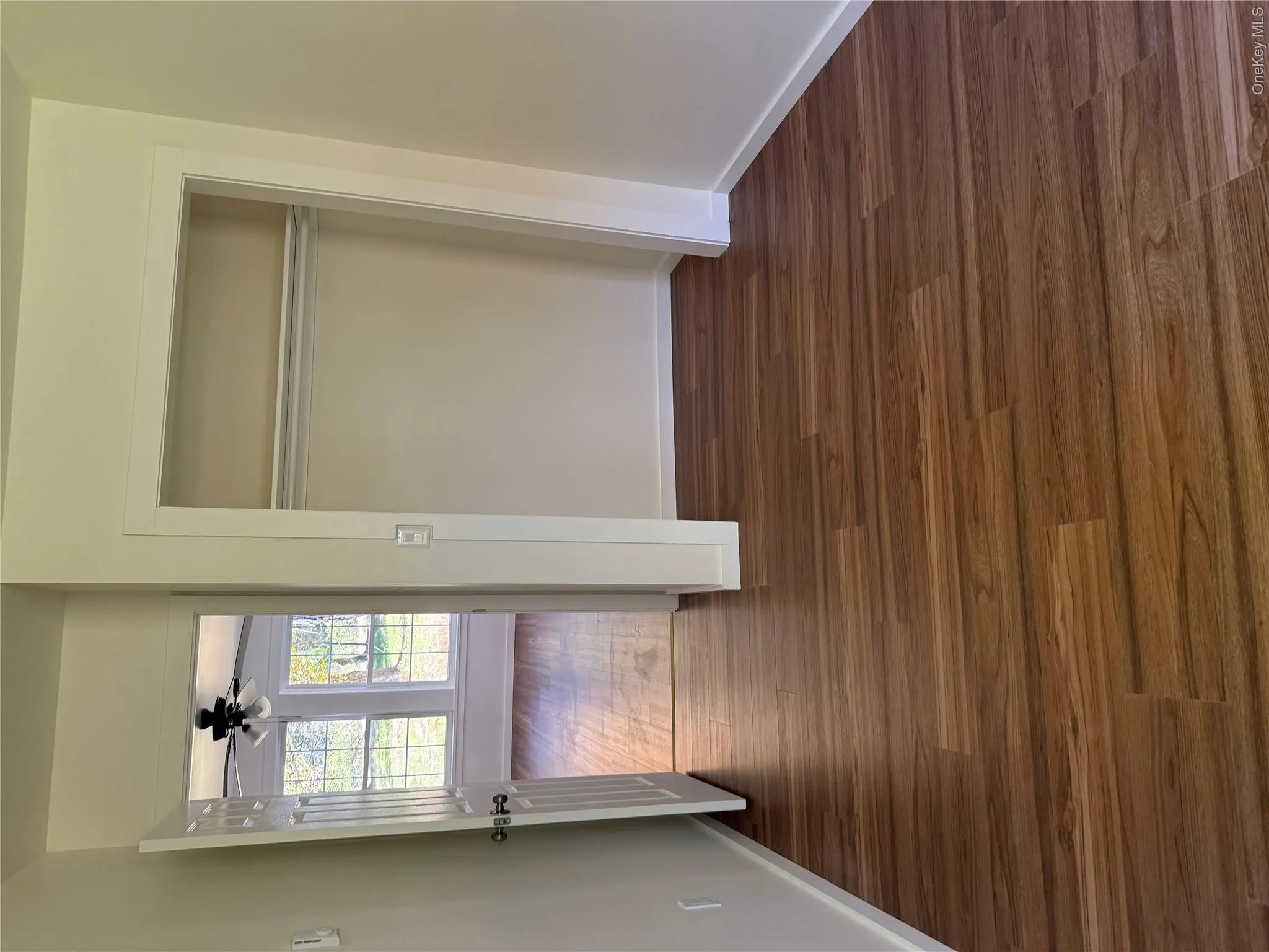 Unfurnished bedroom featuring dark wood finished floors and a closet Unfurnished bedroom featuring dark wood finished floors and a closet