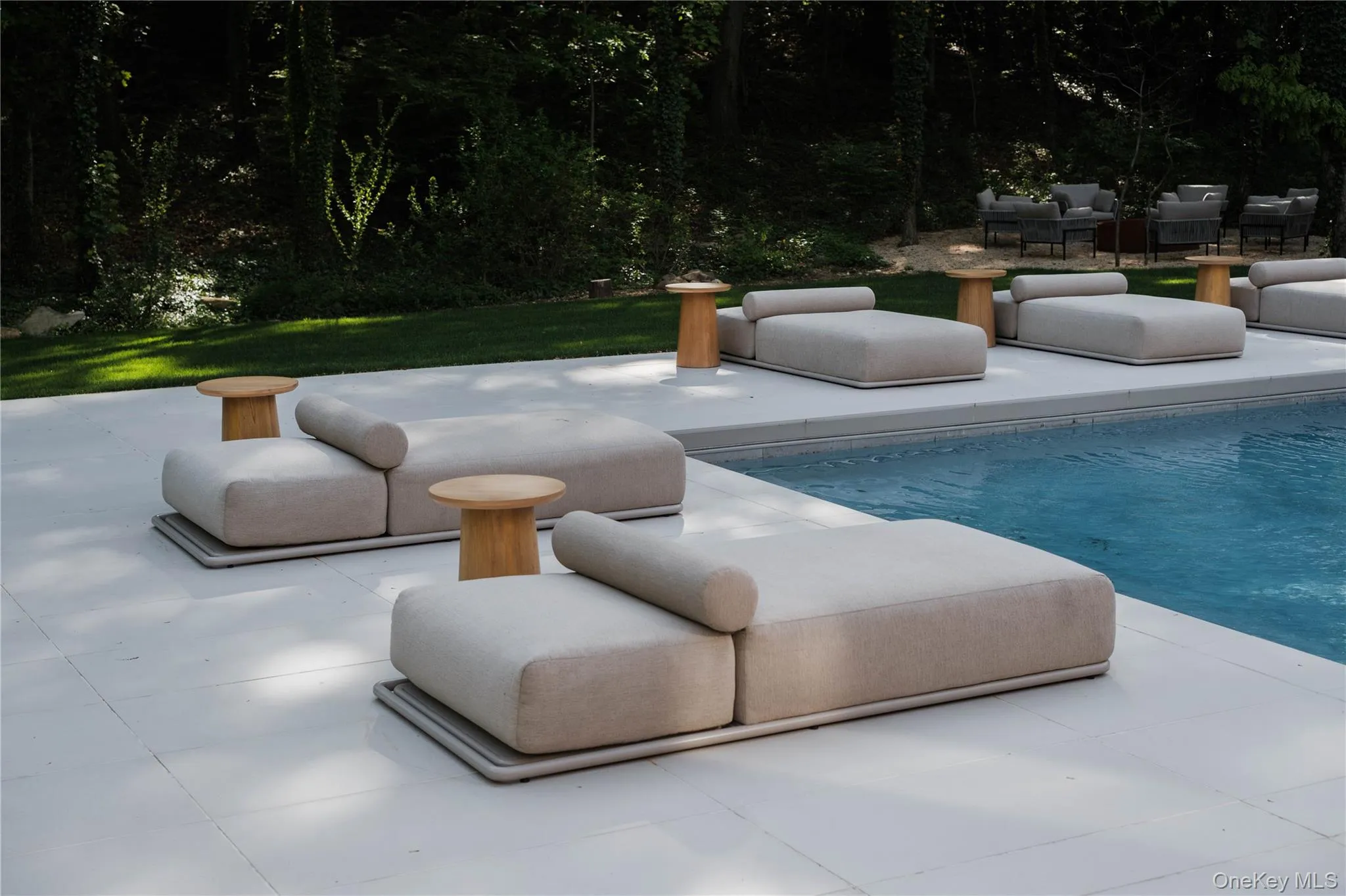 In-ground gunite pool w/ 24" x 48" porcelain pavers. In-ground gunite pool w/ 24" x 48" porcelain pavers.