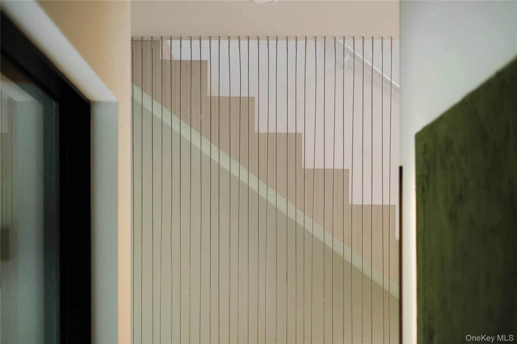 Steel rod waterfall wall staircase. Steel rod waterfall wall staircase.